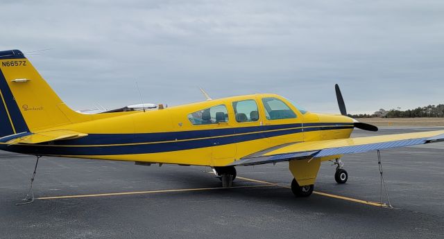 Beechcraft Bonanza (33) (N6657Z) - N6657Z stationary at KOXB (Ocean City Municipal Airport)