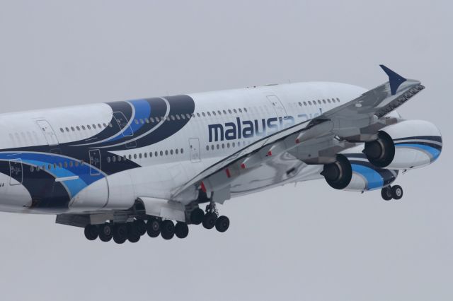 Airbus A380-800 — - Small condensation cloud forms over the wing of this departing MAS A380.