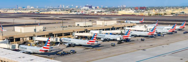 Airbus A321 (N538UW) - American Airlines planes parked at Terminal 4 of PHX on 12/7/22. Taken with a Canon R7 and Tamron 70-200 G2 lens. 94 MP stitched panorama.