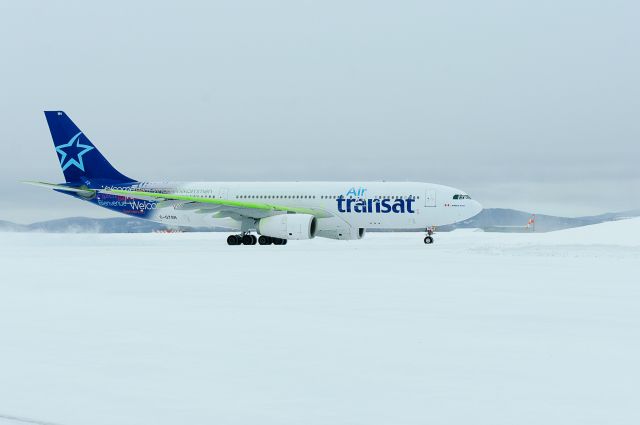 Airbus A330-300 (C-GTSN) - Operating flt TSC523 medical diversion at CYYR from London, UK 17Feb2013. Green on the wing is de-icing fluid.