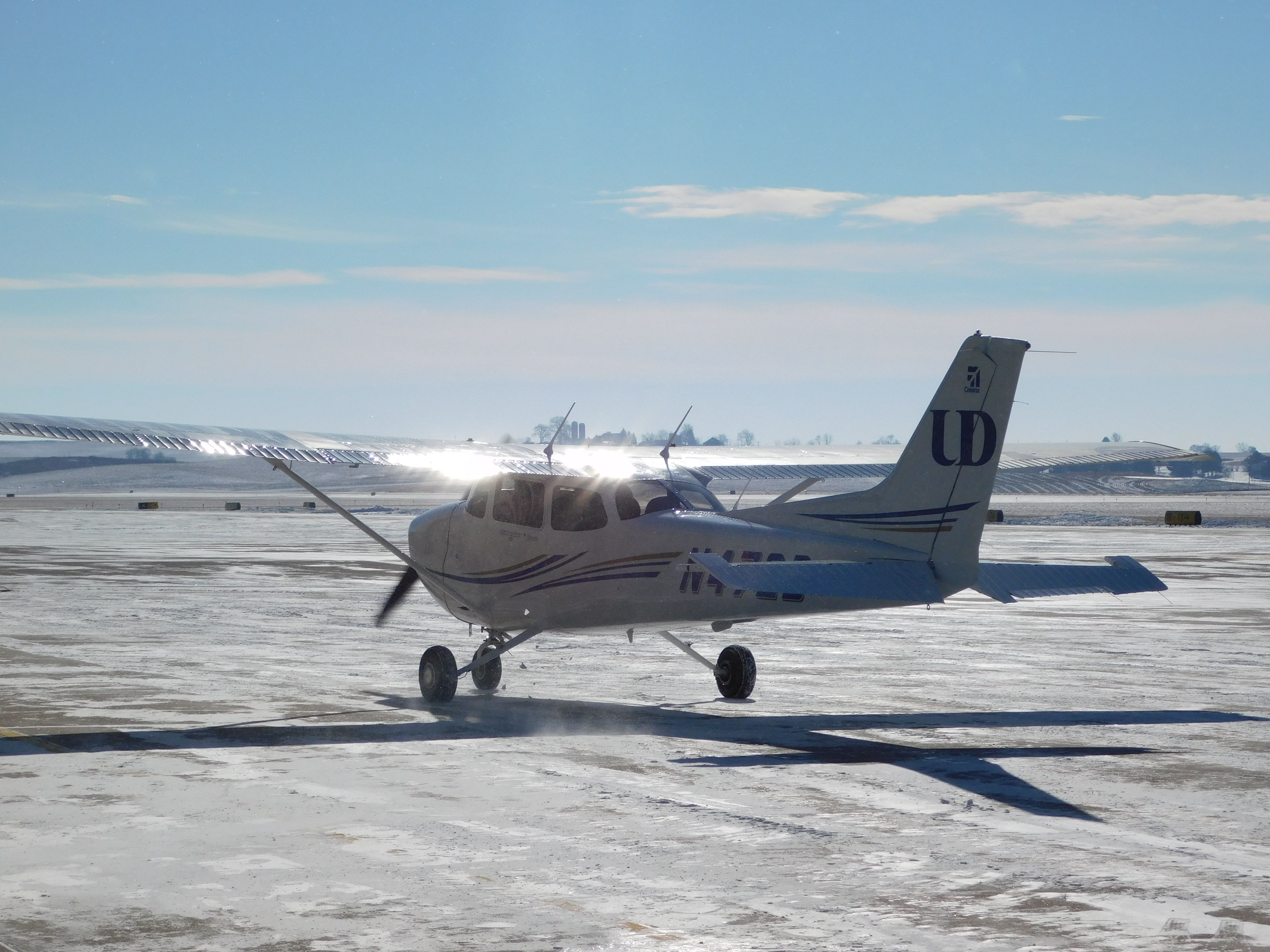 Cessna Skyhawk (N472D) - A clear day in January meant a busy day of flying for University of Dubuque Aviation students.  In this case a nearly empty ramp was a good thing!!!  N472D taxis to park after landing. 