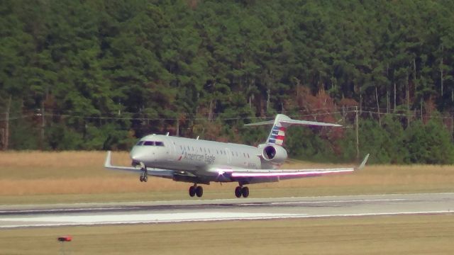 Canadair Regional Jet CRJ-700 (N542EA) - N542EA flares for landing on 23R