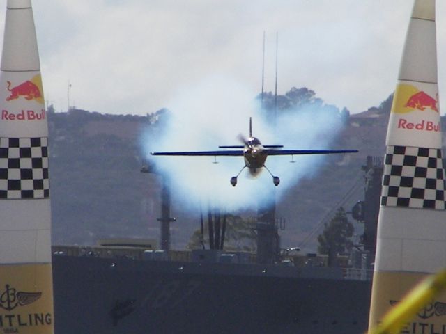 ZIVKO Edge 540 (N423KC) - Red Bull Air Race 2007  San Diego, CA  Kirby Chambliss Thru the Start/Finish! Kinda far away.