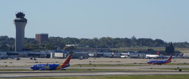 — — - N767SW and N719SW taxi to their respective gates.