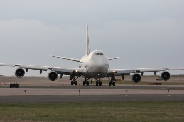 Boeing 747-400 (D-ABTF) - Taxiing to its gate after landing on 16L on a cloudy day.