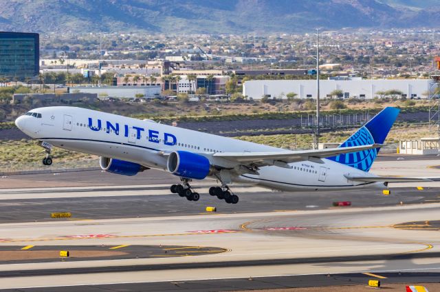 Boeing 777-200 (N771UA) - A United Airlines 777-200 taking off from PHX on 2/13/23, the busiest day in PHX history, during the Super Bowl rush. Taken with a Canon R7 and Canon EF 100-400 II L lens.