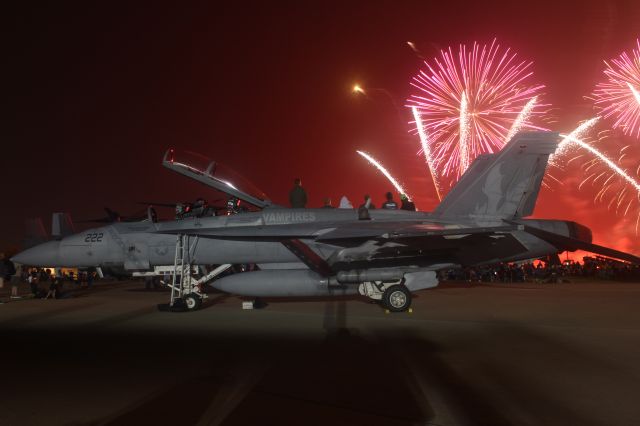 McDonnell Douglas FA-18 Hornet — - Navy Training Squadron VAQ -129 has a group of onlookers on its wing for the Saturday Night Extravaganza at Oshkosh 2021.br /br /VAQ-129 Growlers from Whidbey Island, WA Puget Sound.