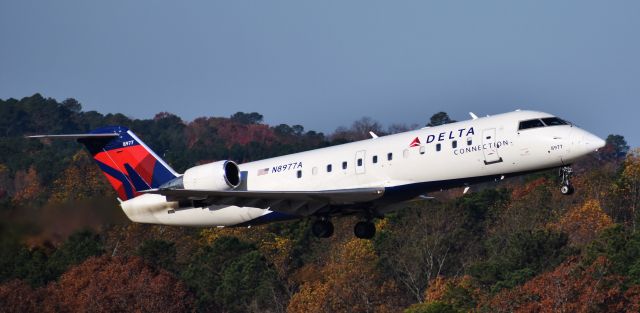 Canadair Regional Jet CRJ-200 (N8977A) - At the RDU observation deck, on the morning of 11/22/17.  Lil CRJ looks rather graceful here.