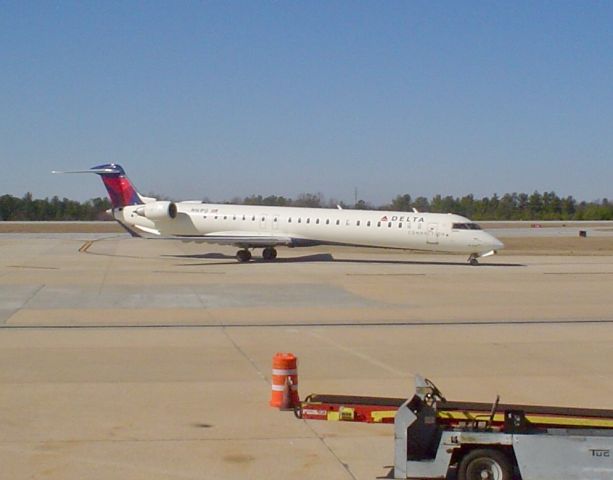 Canadair Regional Jet CRJ-900 — - Taken spring 2009.  Note the Northwest beltloader still in use!