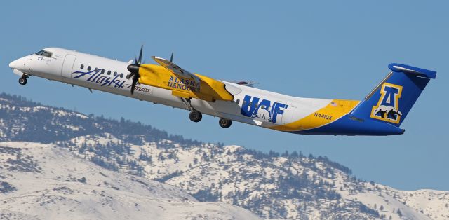 de Havilland Dash 8-400 (N441QX) - As the wheels retract up into the wells, QXEs N441QX, the University of Alaska Fairbanks college-themed Dash 8, climbs past the snow covered Sierra Nevada after taking off from RNO.