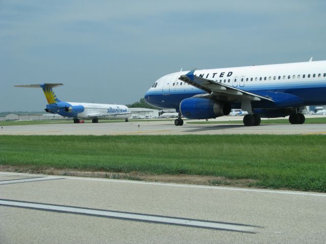 — — - Allegiant MD 83 and UAL A-320 hold short of RWY 19 at RFD