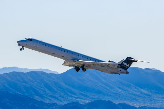 Canadair Regional Jet CRJ-900 (N922FJ) - A Mesa Airlines CRJ900 taking off from PHX on 2/16/23. Taken with a Canon R7 and Tamron 70-200 G2 lens.