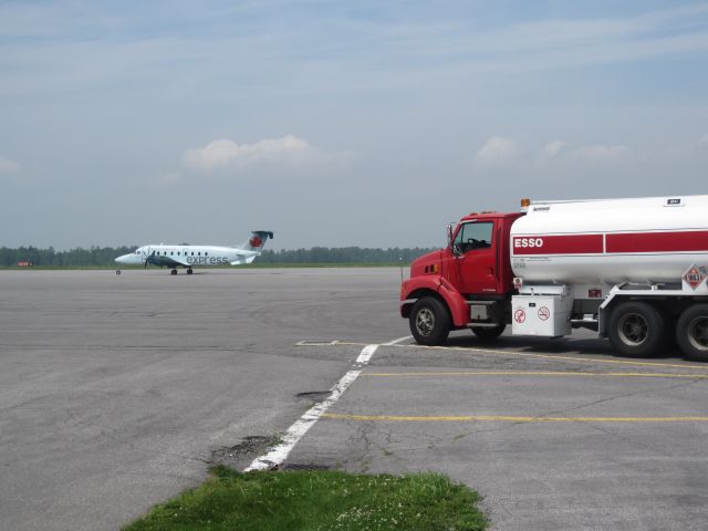 Beechcraft 1900 (C-GORA) - This dedicated to all those who yearn to fly, like this fuel truck