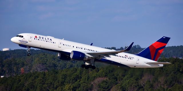 Boeing 757-200 (N694DL) - The Spirit of Freedom blasting off to ATL.  Totally was not expecting this bird, as I had come out for the American Astrojet retro and one of the Comco 757s.  Made me VERY happy.  From the RDU parking deck, 12/10/17.