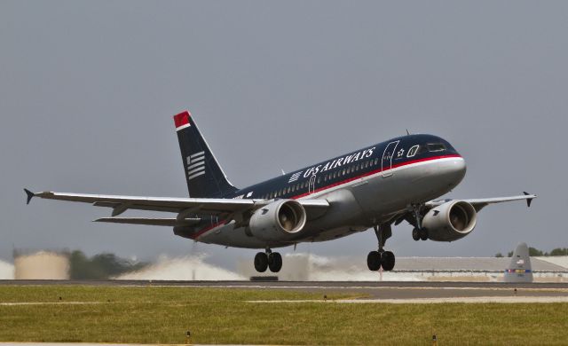 Airbus A319 (N740UW) - Midday takeoff from runway 18L, Charlotte, North Carolina USA