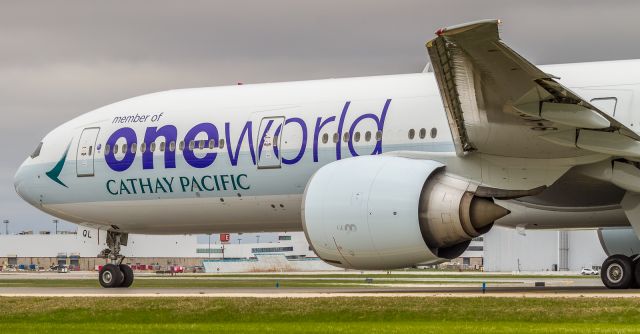 BOEING 777-300ER (B-KQL) - Cathay Pacific 773 rolls by on her way to a runway 05 departure and home