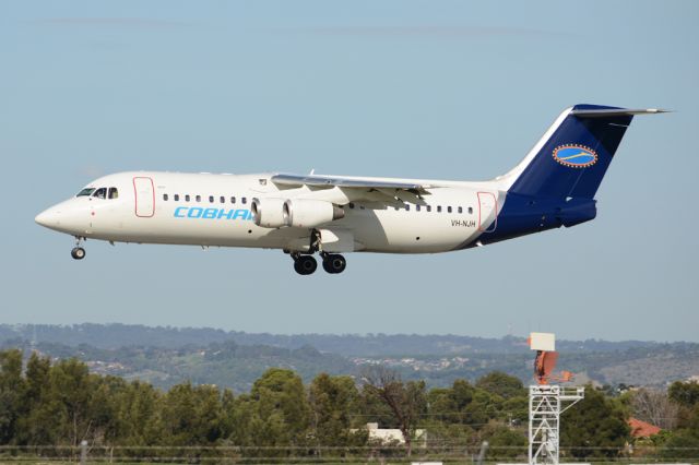 Avro RJ-100 Avroliner (VH-NJH) - On short finals for runway 05. Wednesday, 21st May 2014.