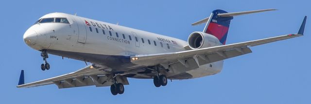 Canadair Regional Jet CRJ-200 (N8894A) - Short final , 24 left