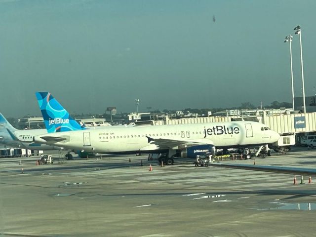 N637JB — - N637JB waiting it's next assignment with a Frontier A320NEO both in FLL since Wednesday's downpours 