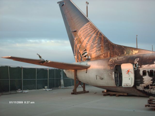 Boeing 737-700 (N18611) - The Continental flight that never left Denver. Flight 1404, they put the remains on the Continental hangar ramp for the investigation.