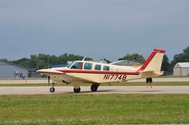 Beechcraft Bonanza (36) (N17748) - Bonanza mass arrival at AirVenture 2014