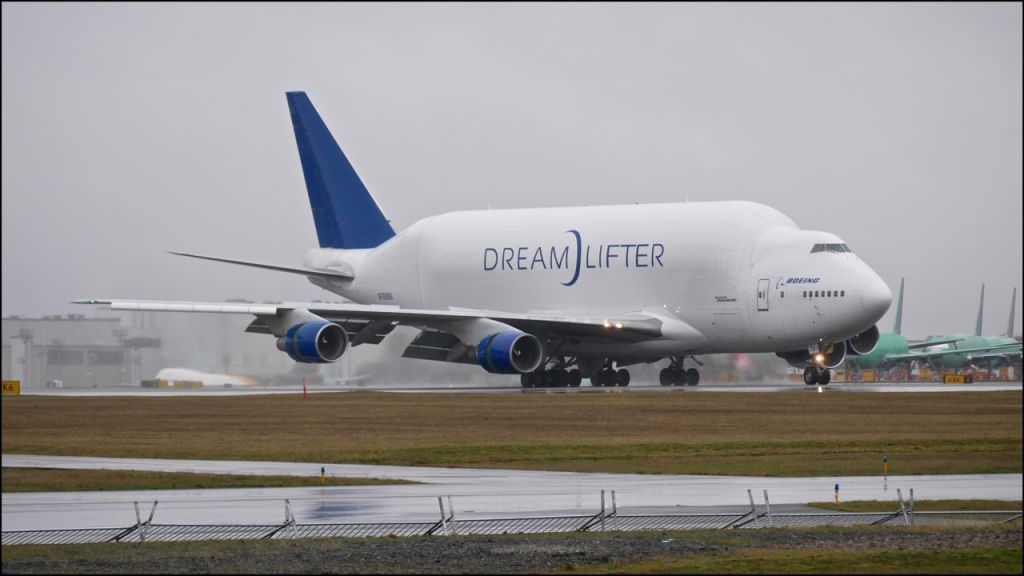 Boeing Dreamlifter (N780BA) - GTI4151 rolling out on Rwy 16R after landing to complete a flight from NGO on 1.23.18. (ln 778 / cn 24310).  Heavy rain was over the airfield when it arrived. Why on earth would a plane spotter be out in this weather?  Crazy!