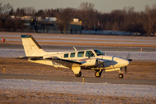 Beechcraft Baron (58) (N581CK) - KFS10 on Bravo taxiing to the Kalitta Ramp.