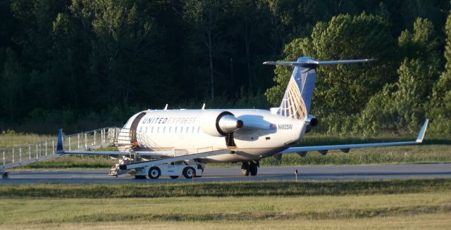 Canadair Regional Jet CRJ-200 (N492SW) - Shortly after arrival from Washington D.C. is this 1997 United Express Canadair Regional Jet 200LR from the Spring of 2021.