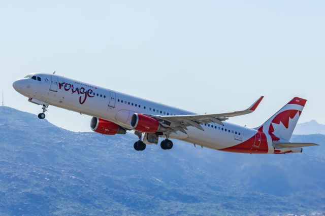 Airbus A321 (C-FJQL) - An Air Canada Rouge A321 taking off from PHX on 2/11/23 during the Super Bowl rush. Taken with a Canon R7 and Canon EF 100-400 II L lens.