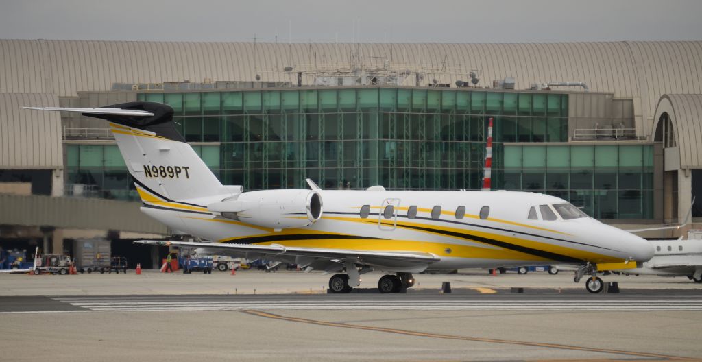 Cessna Citation III (N989PT) - I really like the colors on this Citation. About to depart runway 20R at John Wayne Airport or Orange County Airport or Santa Ana Airport (whichever name they call the airport today. I was on a flight about 4 years ago and the pilot didnt know which name to use so he just used all three one after another every time he referred to the airport) 