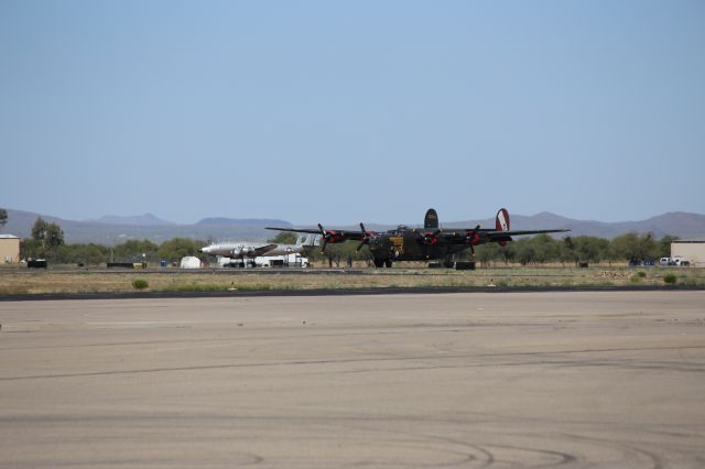 Consolidated B-24 Liberator (N224J) - Collings Foundation Consolidated Liberator B-24J, Witchcraft, on 18 April 2015.  Eisenhowers Constellation, VC-121A-LO, Columbine II, SN: 48-0610, is seen in the background.