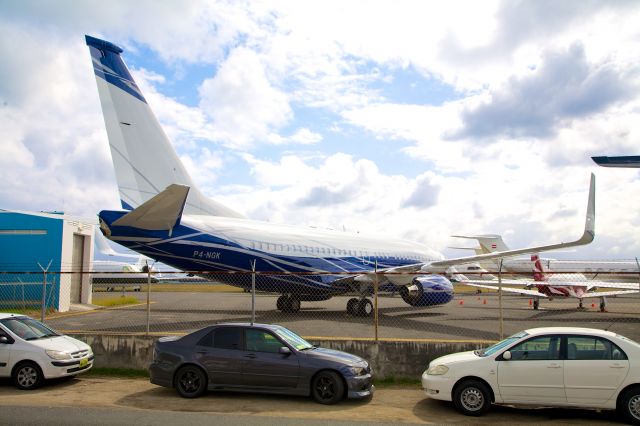 Boeing 737-700 (P4-NGK) - A privately owned 737 tucked into the executive jet parking area at Sint Maarten.  This is the best image available - it's really squirreled away on the apron..