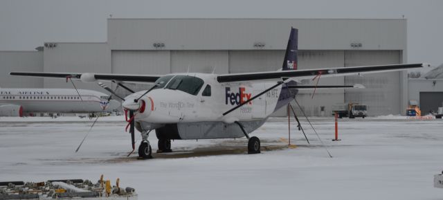 Cessna Caravan (N874FE) - N874FE seen in the snow at KCLE. Please look for more photos at Opshots.net