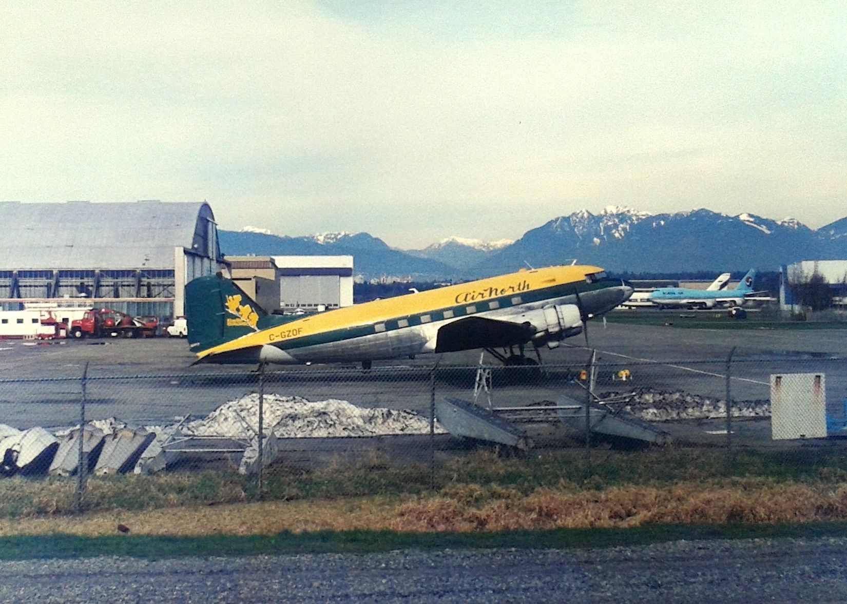 Douglas DC-3 (C-GZOF) - CYVR - Air North DC-3 on the ramp on the south terminal side Feb 23rd, 1995. Flat bed scan last night just to prove I cannot do a quality scan. This was about 3 degrees w/wind when I took this photo...Id never been in such cold weather. Minolta XD-11 color print.