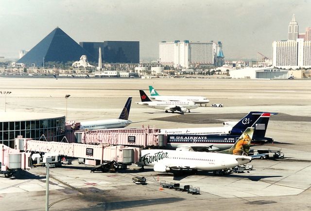 BOEING 737-300 (N319FL) - KLAS from a couple of years ago, poss Mar 2001. The US Airways is N719US and the Champion 727 is N681CA