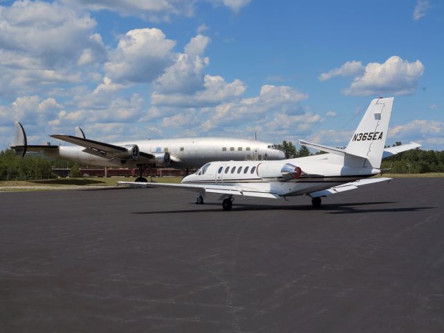 Cessna Citation V (N365EA) - The Constellation in the backgound is used for spare parts on a restauration project of Lufthansa at KLEW.