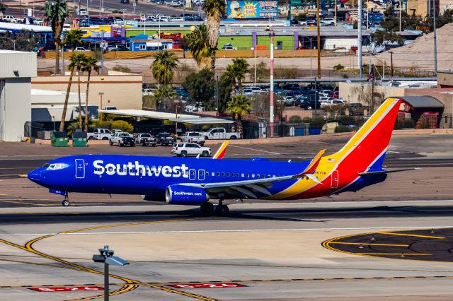 Boeing 737-800 (N8675A) - A Southwest Airlines 737-800 landing at PHX on 3/4/23. Taken with a Canon R7 and Canon EF 100-400 L II lens.