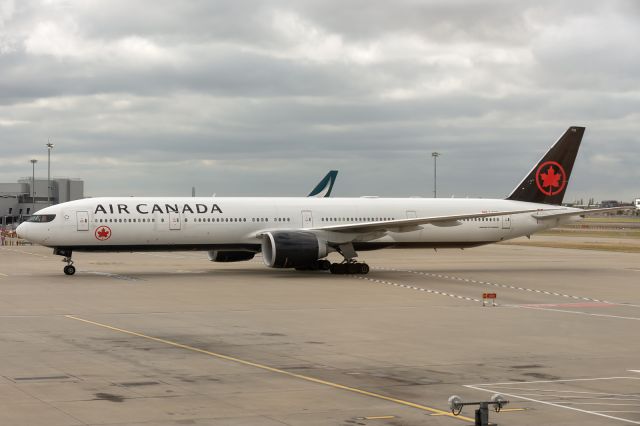BOEING 777-300ER (C-FIUR) - 10th August, 2024: Red-eye flight AC 858 from Toronto Pearson Airport is about to park at London Heathrow's Terminal 2 Gate B37. 