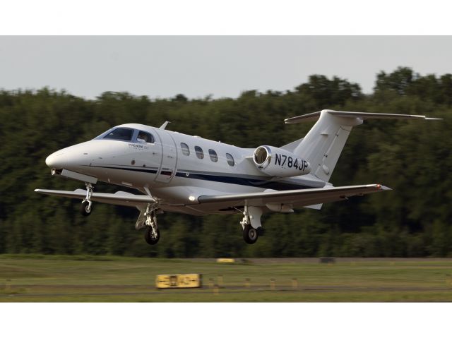Embraer Phenom 100 (N784JP) - Take off RW26. CFM (Corporate Flight Management) has a brand new Phenom 100 available for charter in the New York metropolitan area. KDXR KHPN KTEB KBDR   www.flycfm.com