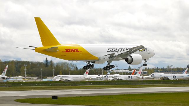 Boeing 777-200 (N777SA) - BOE109 (LN:1011) on final approach to runway 16R on 4/16/12. The aircraft is returning from KPDX where it was painted.