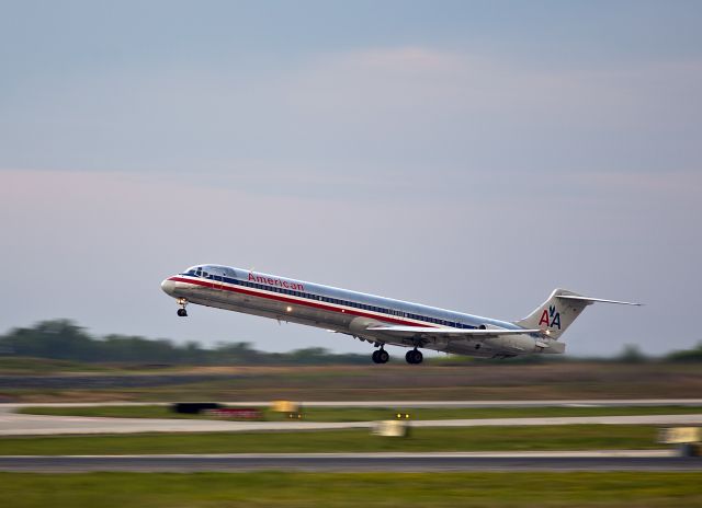 McDonnell Douglas MD-80 (N626A) - Evening take off from runway 18C, Charlotte, North Carolina. Every photo has a story. I noticed that the light had gotten soft and yellowish because clouds were moving in and making the light interesting.
