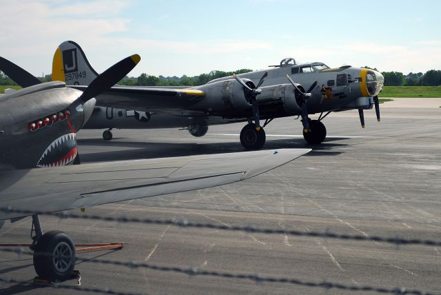 Boeing B-17 Flying Fortress (N390TH) - Liberty Belle parked at Wheeler Downtown Airport in Kansas City, MO with a P-40 in the foreground. This picture was taken on May 22, 2011. This aircraft crashed on June 13, 2011 and was a total loss.