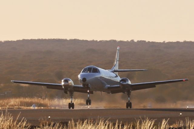 Fairchild Dornier SA-227DC Metro (VH-KGX) - Landing on RWY 27 in bright early morning sunlight