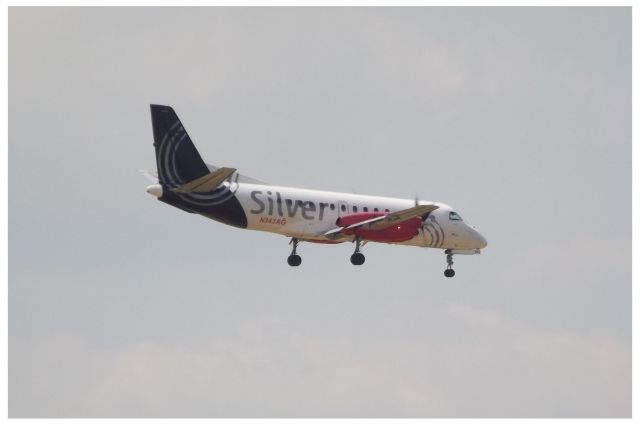 Saab 340 (N343AG) - From the 9th floor balcony of the Best Western Plus on Central Ave.