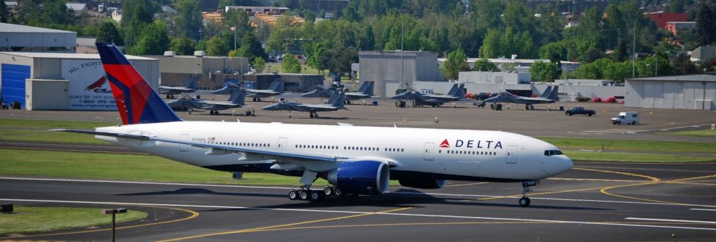 Boeing 777-200 (N708DN) - Delta Airlines Boeing 777 taking off from 28L at Portland International Airport.