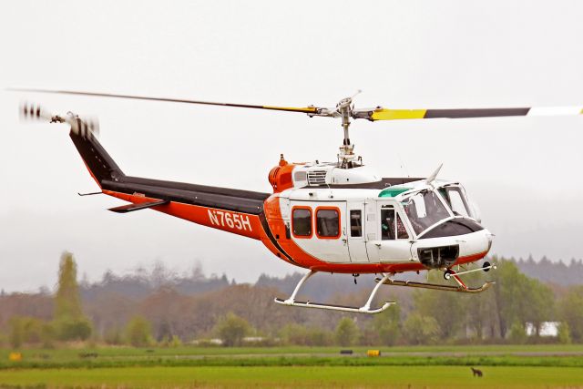 Bell UH-1V Iroquois (N765H) - Bell 205A-1 departing Hillsboro Aviation, a Bell Service Center. 4-23-13