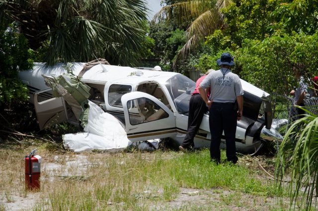 Beechcraft Bonanza (36) (N7513) - Veteran pilot James Smith was able to walk away with nary a scratch from this early morning incident west of KPMP.  Though the $670K aircraft was a total loss, he managed to navigate it ten yards short of occupied adjacent residences.