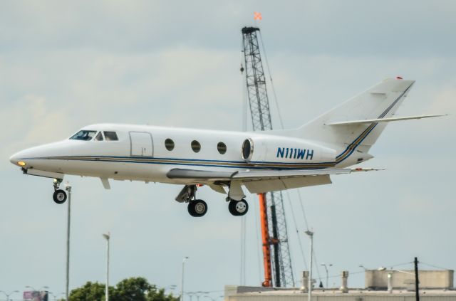 Dassault Falcon 10 (N111WH) - Could there be a rock star on board? That was the hope as this was shot on opening day of week two of the Austin City Limits Music Festival.