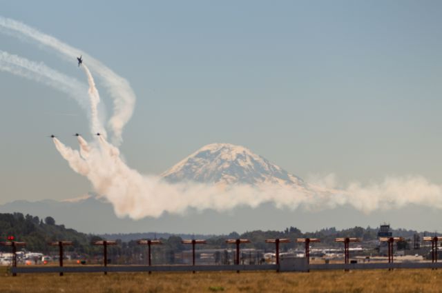 16-3708 — - Following their demonstration practice, the US Navy's Blue Angels return to Boeing Field Seattle in formation, then peel off to get into the pattern for landing with Mt Rainier in background