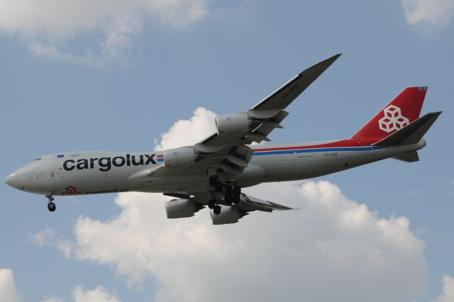BOEING 747-8 (LX-VCG) - Well, never fails, a cloud passing in front of the sun preventing full lighting on the aircraft you want most. Dang it! Frustration. First time to shoot this reg #. Landing 23-R at KIND.